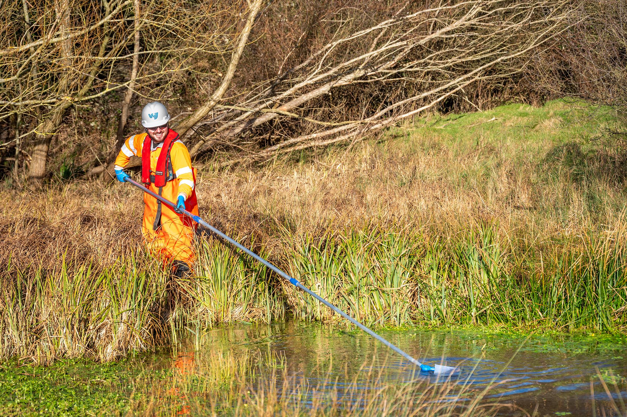 worker using water monitoring equipment